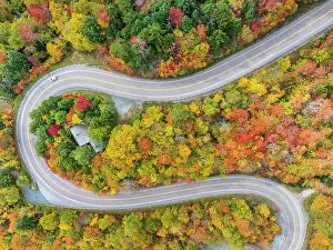 Lane Prints: Aerial view of twisting road with vehicle in autumn, Schuss Pass, Waitsfield, Vermont, USA