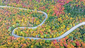 Roads Prints: Aerial view of twisting road with vehicle in autumn, Schuss Pass, Waitsfield, Vermont, USA