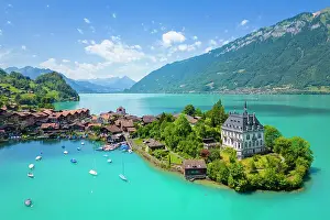 Aerial view of the village of Iseltwald and it's peninsula with the old Castle on Lake Brienz. Iseltwald, Lake Brienz, Bernese Oberland, Interlaken-Oberhasli district, Canton of Bern, Switzerland