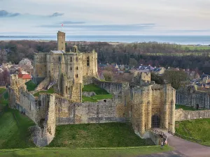 Northumberland Prints: Aerial view of Warkworth Castle in Northumberland, England. Winter (March) 2025