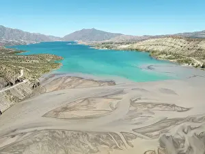 Mouth Prints: Aerial view of the waters of the Mendoza River blending into the Potrerillos Lake Dam