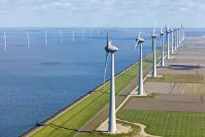 Aerial view of wind turbines on land and at sea, North Holland, Netherlands