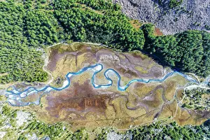 Creek Prints: Aerial view of the winding Duino river in autumn in Preda Rossa valley