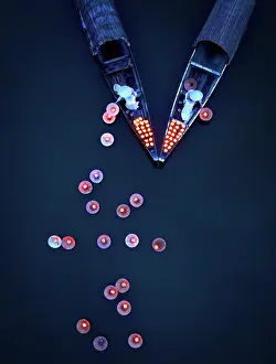 Straight Down Prints: Aerial view of women laying floating lanterns on the Perfume River at dusk