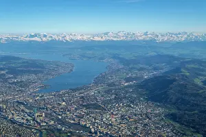Elevated Prints: Aerial view of Zurich, Switzerland and its lake with snowy Alps in the background