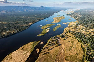 : Aerial of Zambezi River. Zambia on left, Zimbabwe on right, Zimbabwe