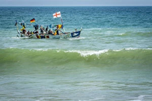 Worker Gallery: Africa, Benin, Grand Popo. A colorful fishing boat coming back home
