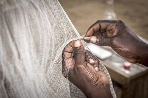 Images Dated 28th September 2016: Africa, Benin, Grand Popo. Man repairing his fishing net. Detail