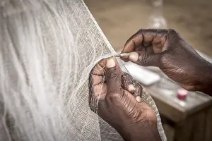 Hands Prints: Africa, Benin, Grand Popo. Man repairing his fishing net. Detail