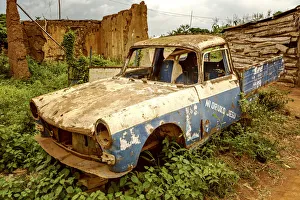 Benin Prints: Africa, Benin, Ketou. A broken car at the outskirts of Ketou