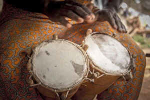 Drummer Collection: Africa, Benin, Porto Novo, Ajara. A drum player with a double bongo drum