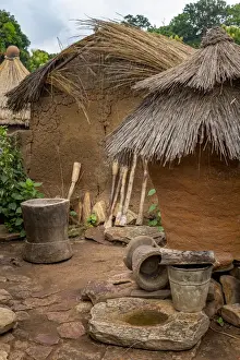 Open Air Prints: Africa, Benin, Taneka Koko. a still life of the open air kitchen and storage huts