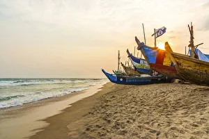Africa, Ghana, Elmina and surroundings. Traditional fishing boats on the beach in