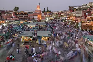 Marrakech Prints: Africa, Morocco, Marrakech, Busy market of Jemaa el-Fnaa at dusk