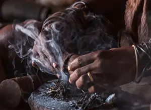 Namibian Prints: Africa, Namibia, Damara Land. Preparing traditional Himba perfume