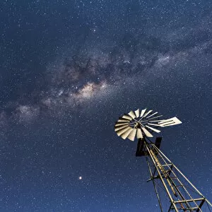 Images Dated 16th August 2018: Africa, Namibia, near Keetmanshop. Milky way with waterpump