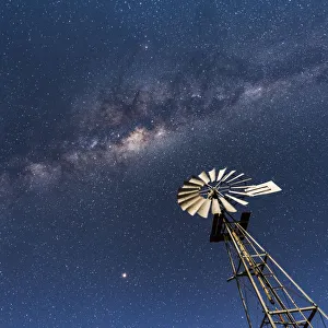 Images Dated 16th August 2018: Africa, Namibia, near Keetmanshop. Milky way with waterpump