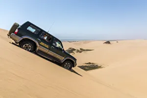 Jeep Prints: Africa, Namibia, Walvis Bay. Jeep safari on a dune