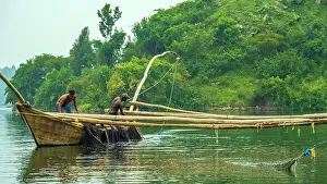Rwanda Prints: africa, Rwanda, Kivu Lake. Fishermen on traditional fishing boats in the middle of the lake near to an island