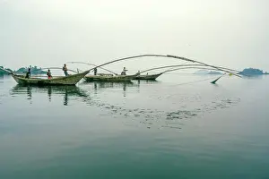 Rwanda Prints: africa, Rwanda, Kivu Lake. Fishermen on traditional fishing boats in the middle of the lake near to some islands
