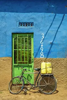 Construction Prints: africa, Rwanda, Kivu Lake. A traditional house with a bicycle on the door on the Congo Nile Trail