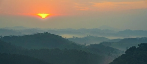 Rainforest Prints: Africa, Rwanda, Nyungwe National Park. Sunrise above the rolling hills