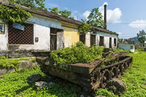 Equatorial Prints: Africa, SA£o Toma and Principe. Abandoned armoured vehicle in Porto Alegre