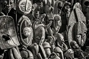 Africa, Senegal, Dakar. Artisanal wooden masks outside the food market