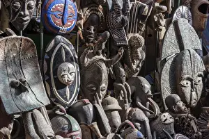 Handmade Prints: Africa, Senegal, Dakar. Artisanal wooden masks outside the food market