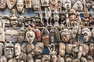 Africa, Senegal, Dakar. Artisanal wooden masks outside the food market