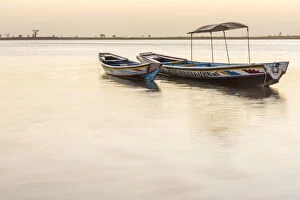Images Dated 29th January 2018: Africa, Senegal, Sine-Saloum-Delta. Fishing boats at sunrise