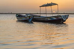 Images Dated 29th March 2018: Africa, Senegal, Sine-Saloum-Delta. Fishing boats at sunrise
