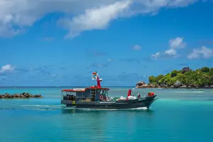 Fisher Men Prints: Africa, Seychelles, La Digue. Fishing boat returning to the harbour