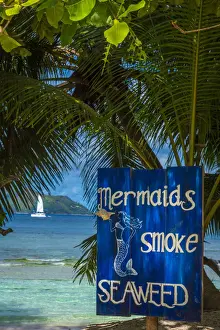 Funny Prints: Africa, Seychelles, La Digue. Funny Bar sign board on Anse Severe beach