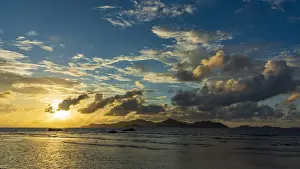 Backlight Prints: Africa, Seychelles, La Digue. Sunset seen from Anse Severe towards the Island of Praslin