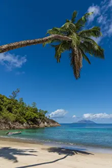 africa, Seychelles, Mahe. Anse Major beach with silhouette Island in the back