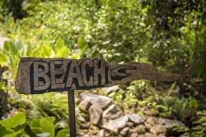 Images Dated 7th January 2022: africa, Seychelles, Mahe. Wooden sign to the beach at Petite Anse, of the Four Seasons Hotel
