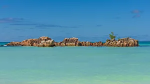 Africa, Seychelles, Praslin. Anse Volbert, rocks in the ocean