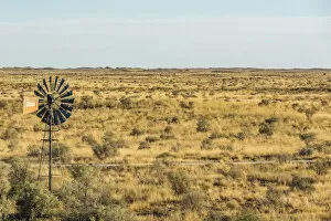 Images Dated 25th January 2017: Africa, South Africa, Kalahari Transfrontier Park. A waterpump near to a water hole