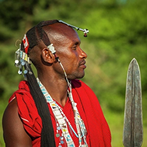 Clothing Prints: africa, Tanzania, Manyara Region. A young Maasai Warrior posing with his spear