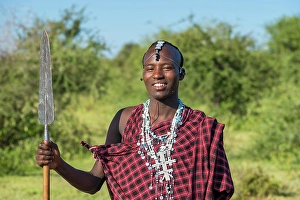 Q1 2025 Prints: africa, Tanzania, Manyara Region. A young Maasai Warrior posing with his spear