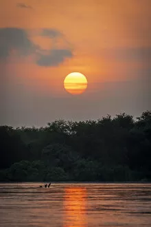 Images Dated 19th February 2020: Africa, Tanzania, Selous National Park. Sunset on the Rufiji River
