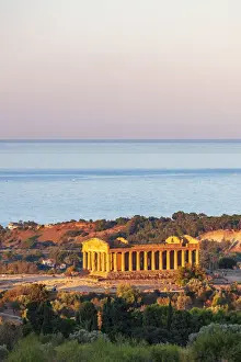 Agrigento Prints: Agrigento, Sicily. Concordia Temple in the Valley of Temples at sunrise with the sea in