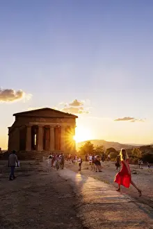 Agrigento Prints: Agrigento, Sicily. People visiting Concordia Temple in the Valley of Temples at sunset