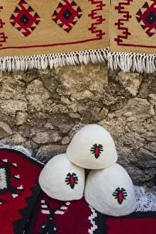 Albanian Prints: Albania, Kruja, town bazaar, Qeleshe traditional Albanian felt hats