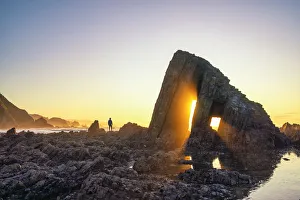 Admiring Gallery: Albuerne, Asturias, Spain, Playa de Los Campizales. A man admiring the sunset