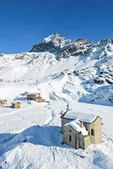Snowy Peaks Prints: Alpe Prabello with Santuario Madonna della Pace and Mount Disgrazia in the background in winter