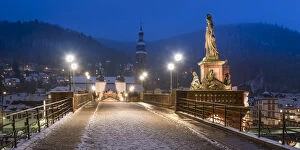 Alte Brucke (Old Bridge) in winter at night, Heidelberg, Baden-Wurttemberg, Germany