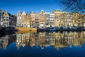 Amsterdam, Netherlands, Europe. Traditional old buildings reflected in the canal