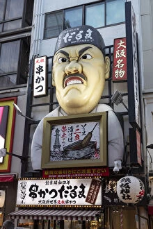 Shopping Gallery: An amusing facade of a Japanese man in front of a restaurant, Osaka, Kansai, Japan